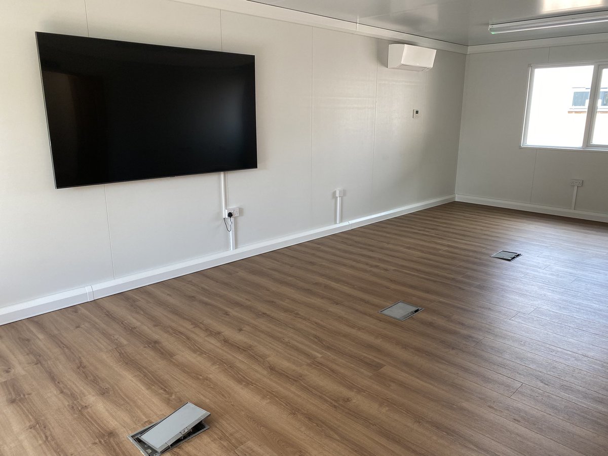 Steveellis06's tweet photo. Finalising the CAT HQ building today. Kitchen delivered. Thanks to @Seven11Systems for the install of the TVs and IT equipment. Flooring done. Now just for the furniture. @CAcademiesTrust https://t.co/Q005aywcCo