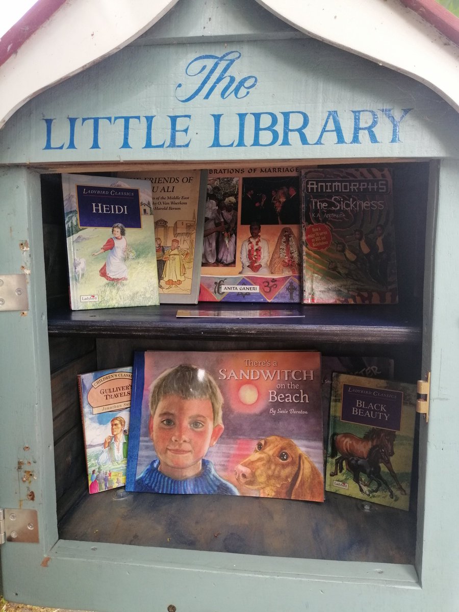 Jan has painted our shelves blue and Susie Darnton has very kindly given us some copies of her beautiful book, 'there's a sandwitch on the beach'. Life is good. That's the tweet.