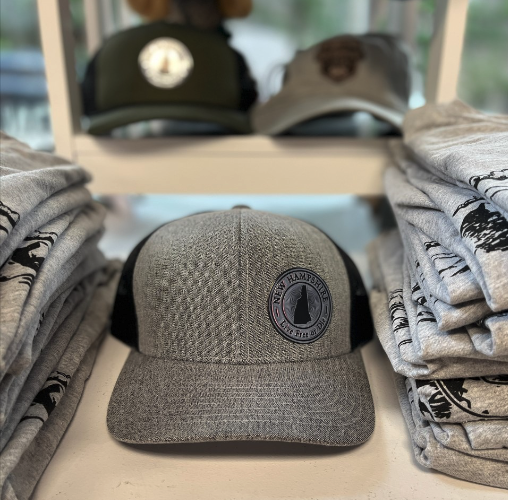 We have patch hats! Check out our amazing selection of New Hampshire hats. We just did a bunch with these awesome patches. 

We can also do custom patches. Whether you are looking for leather, embroidered, acrylic, metallic or something else, we can do it!