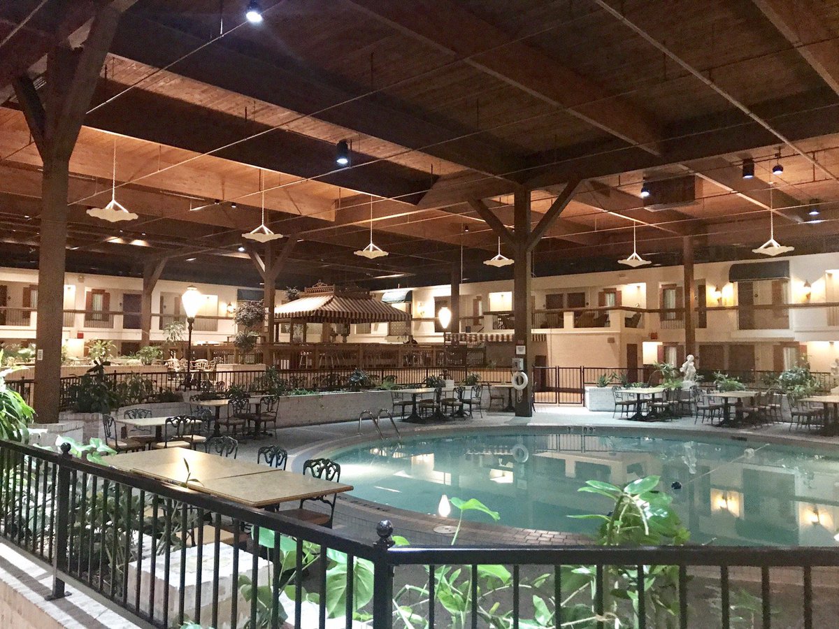 PowellsLeftArm's tweet photo. Revisiting a minor obsession of mine: finding surviving "Holidome" hotels. Built in the 1970s, the concept was mini-resort hotels in unassuming locations built around a massive indoor courtyard and pool. Hard to maintain, many are gone now. Do you know of any still standing? https://t.co/J1syT99xsT