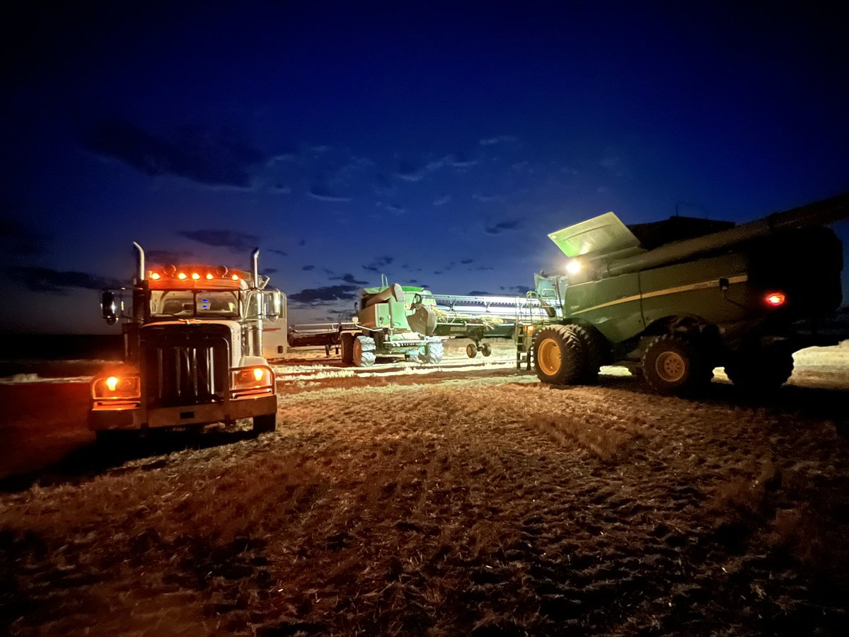 Sam98620's tweet photo. @Wheatwife @JohnDeere Looking quite patriotic! Shutting down at the end  of day. My phone went into some sort of night mode and took this pic. Phone is far better at making adjustments than the operator. Happy Harvesting! https://t.co/tlK9Ezl6iW