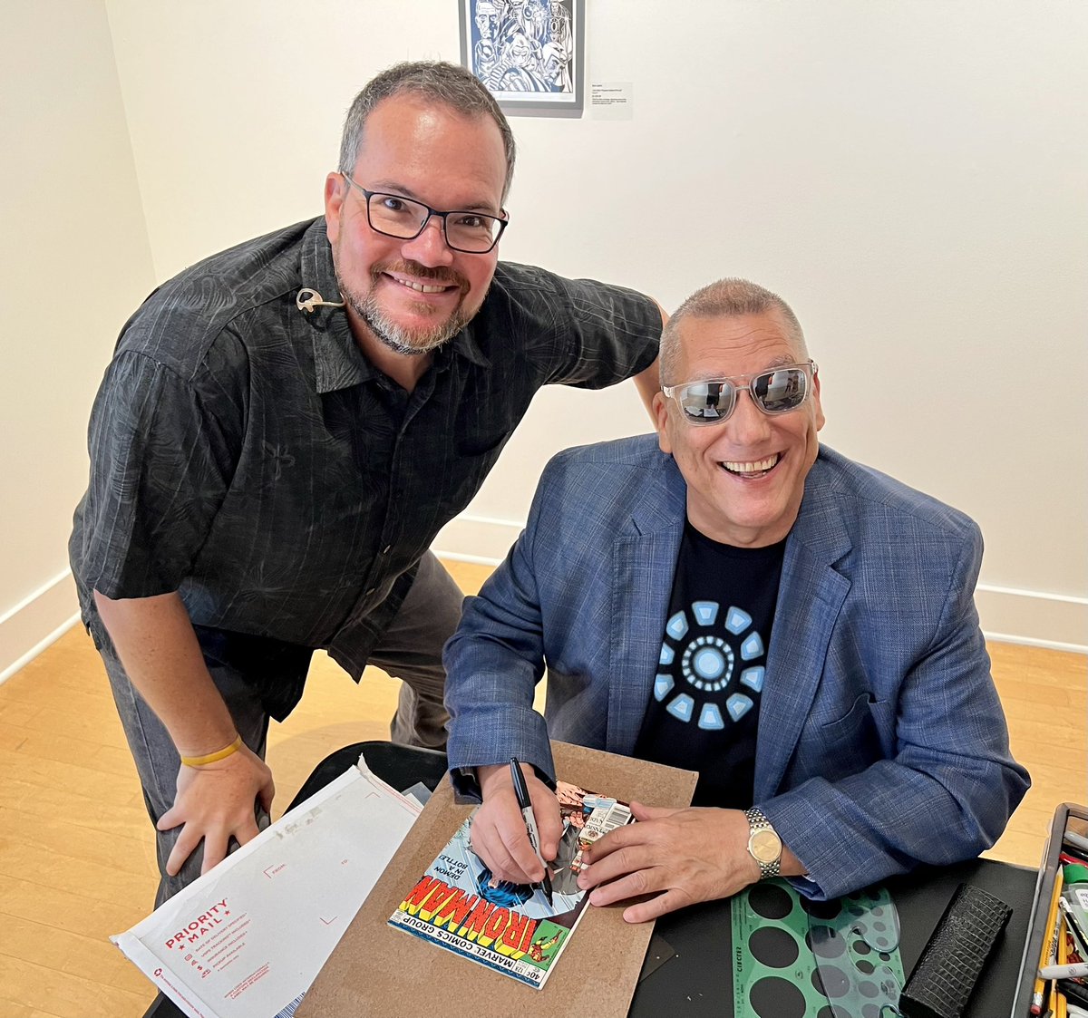 CharleyBelcher's tweet photo. Together again for the very first time! Definitely a thrill to hang with @Bob_Layton this morning. He was nice enough to sign my copy of Demon in a Bottle, and even drew an Iron Man for me. #fanboy #shellhead #grateful #GoodDayTB https://t.co/w194MUN5of