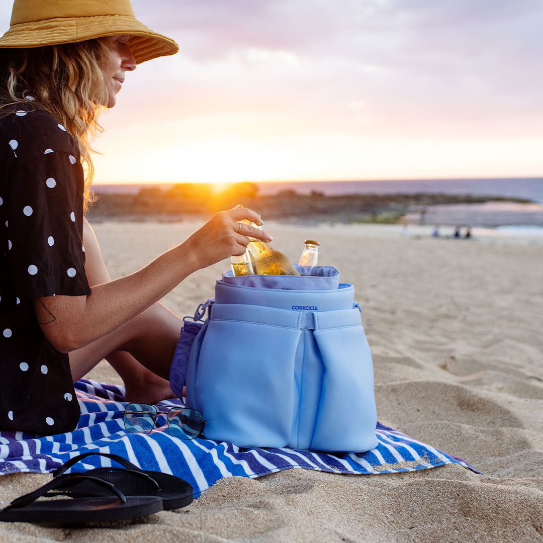 Summer doesn’t stand a chance against our three brand new Soft Cooler silhouettes. Made with the stylish exterior you love, and an ultra-insulated interior to keep you cool on the move— Beverage Bucket Bag, Estelle Tote, and Lotus Pack are now available at corkcicle.com