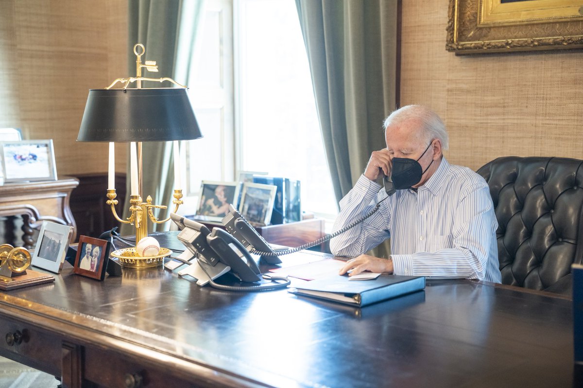 DrEliDavid's tweet image. Today: Biden wearing an N95 mask while alone in isolation, to prevent phone-based transmission 🤡