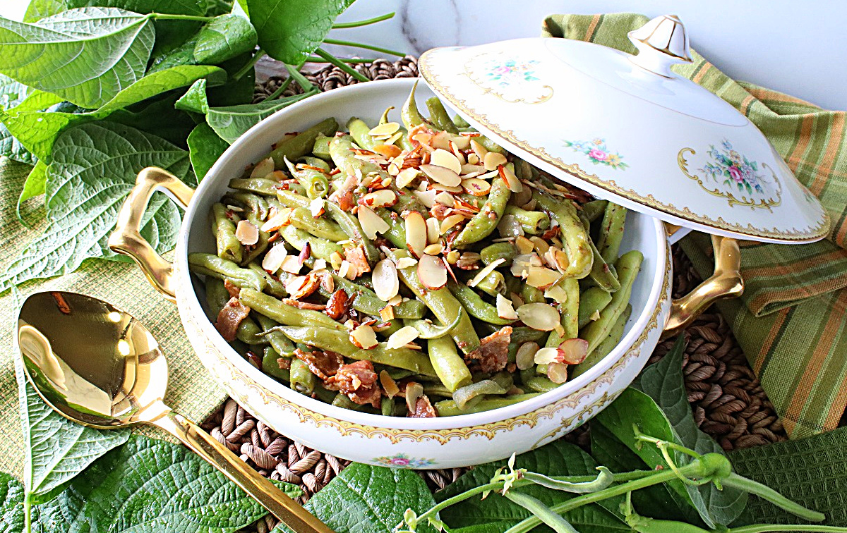 Bacon Bourbon Green Beans Almondine is a delicious bourbon buttery update on a classic and will soon become your favorite way to eat green beans. kudoskitchenbyrenee.com/bacon-bourbon-…