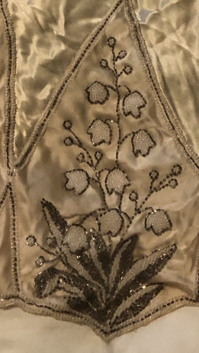 LaurieSargent's tweet photo. This past week I got a treasure in the mail from a cousin: our grandmother’s 1926 wedding dress loaded w/ embroidery and beads. The satin was originally white, but aged yellow. It’s thrilling to touch, & helpful as I write the wedding scene as #narrativeNF or #HistoricalFiction https://t.co/Dmmf50Mp8T