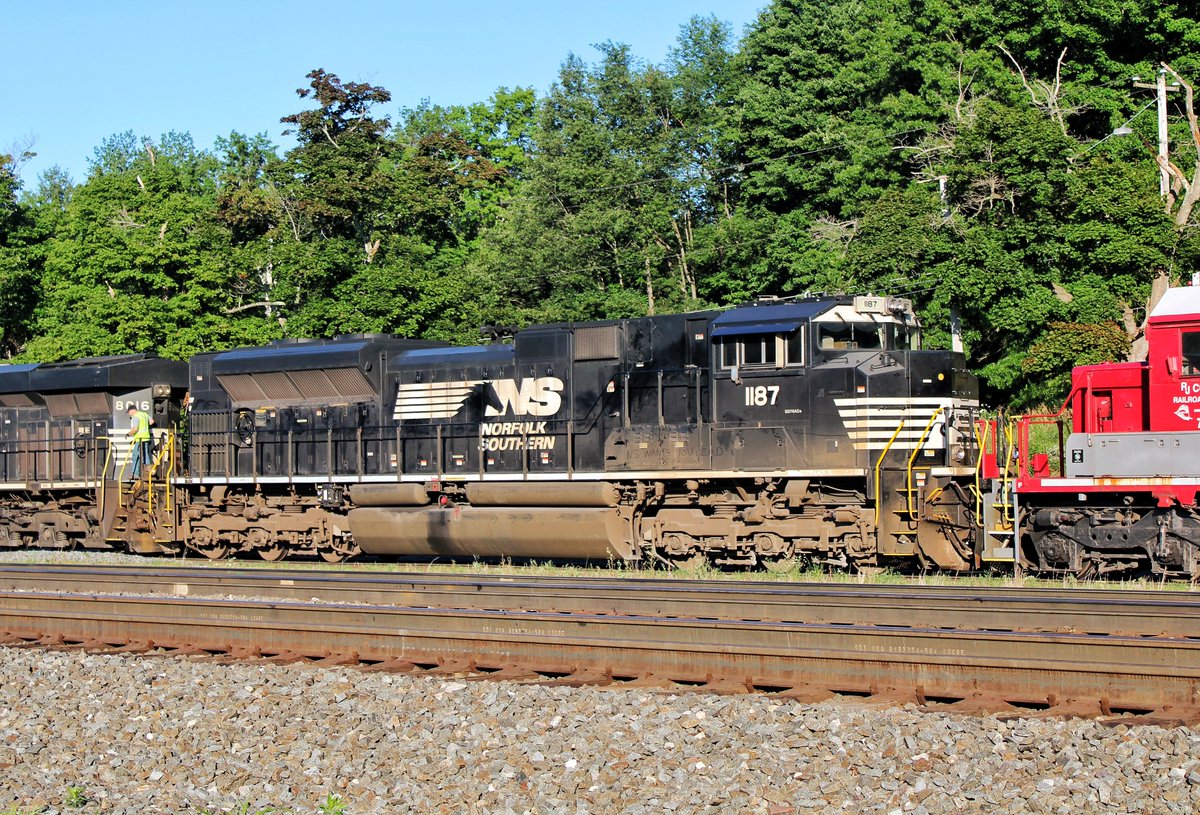 RFPProductions's tweet photo. Upon arrival in one of our weekend destinations, Cresson, PA, we stumbled upon NS 54K waiting to go into the RJ Corman Yard, with two bright red RJ Corman SD40-2s on the point! We first thought this was CP power from a distance, but this was arguably cooler! #RJCP #NS #Railfan https://t.co/ZwMZalv5Jl
