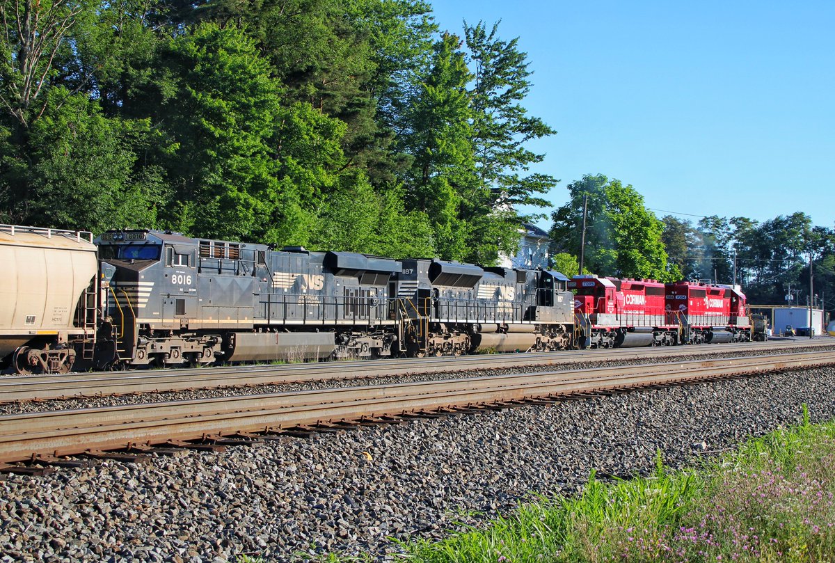 RFPProductions's tweet photo. Upon arrival in one of our weekend destinations, Cresson, PA, we stumbled upon NS 54K waiting to go into the RJ Corman Yard, with two bright red RJ Corman SD40-2s on the point! We first thought this was CP power from a distance, but this was arguably cooler! #RJCP #NS #Railfan https://t.co/ZwMZalv5Jl