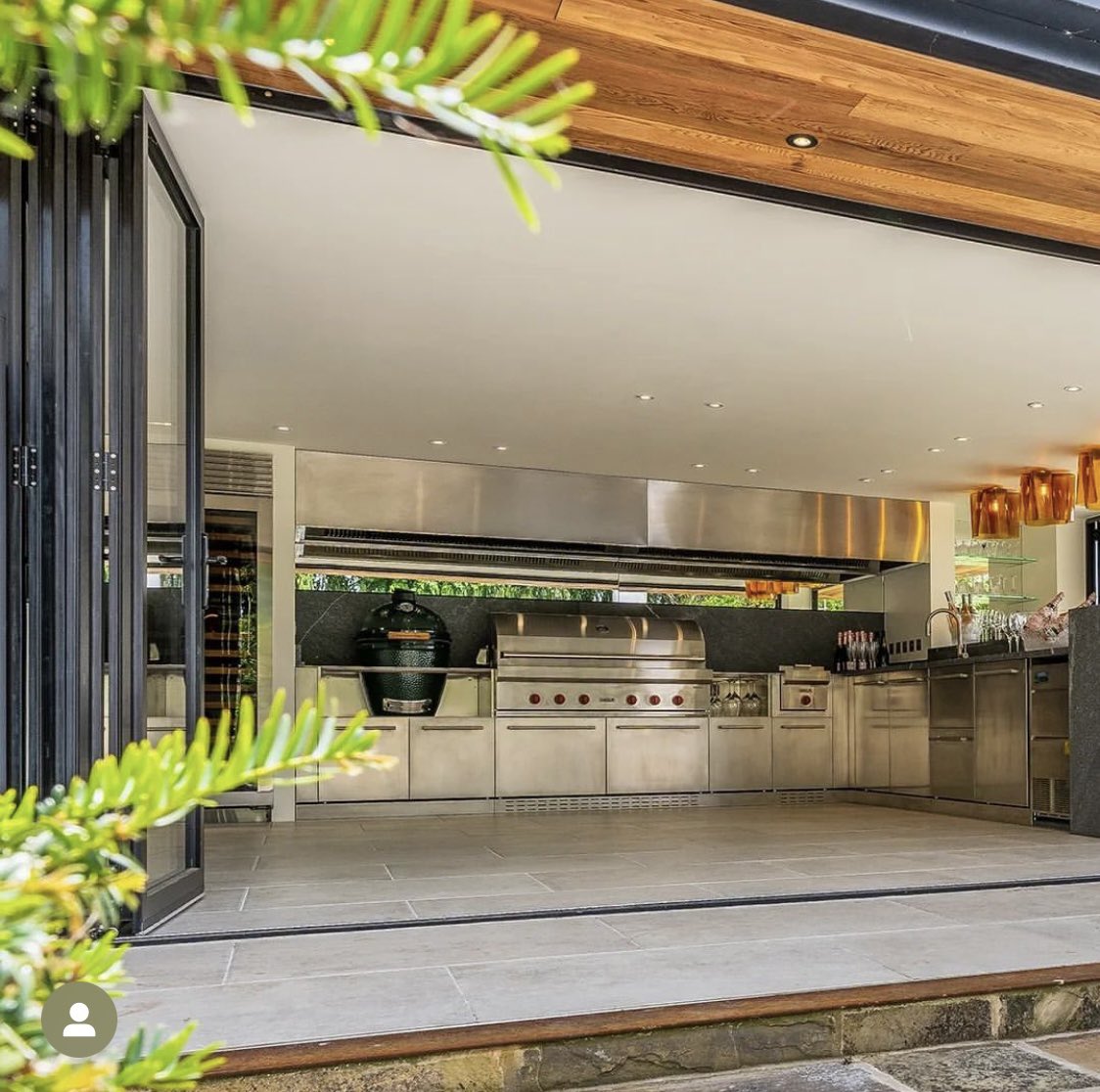 Stunning outdoor kitchen created by the team <a href="/stephenneall/">Stephen Neall Interiors</a> including a made to measure bespoke Westin hood above the <a href="/SubZeroWolfUK/">Sub-Zero & Wolf UK</a> bbq &amp; <a href="/BigGreenEggUK/">Big Green Egg UK</a>