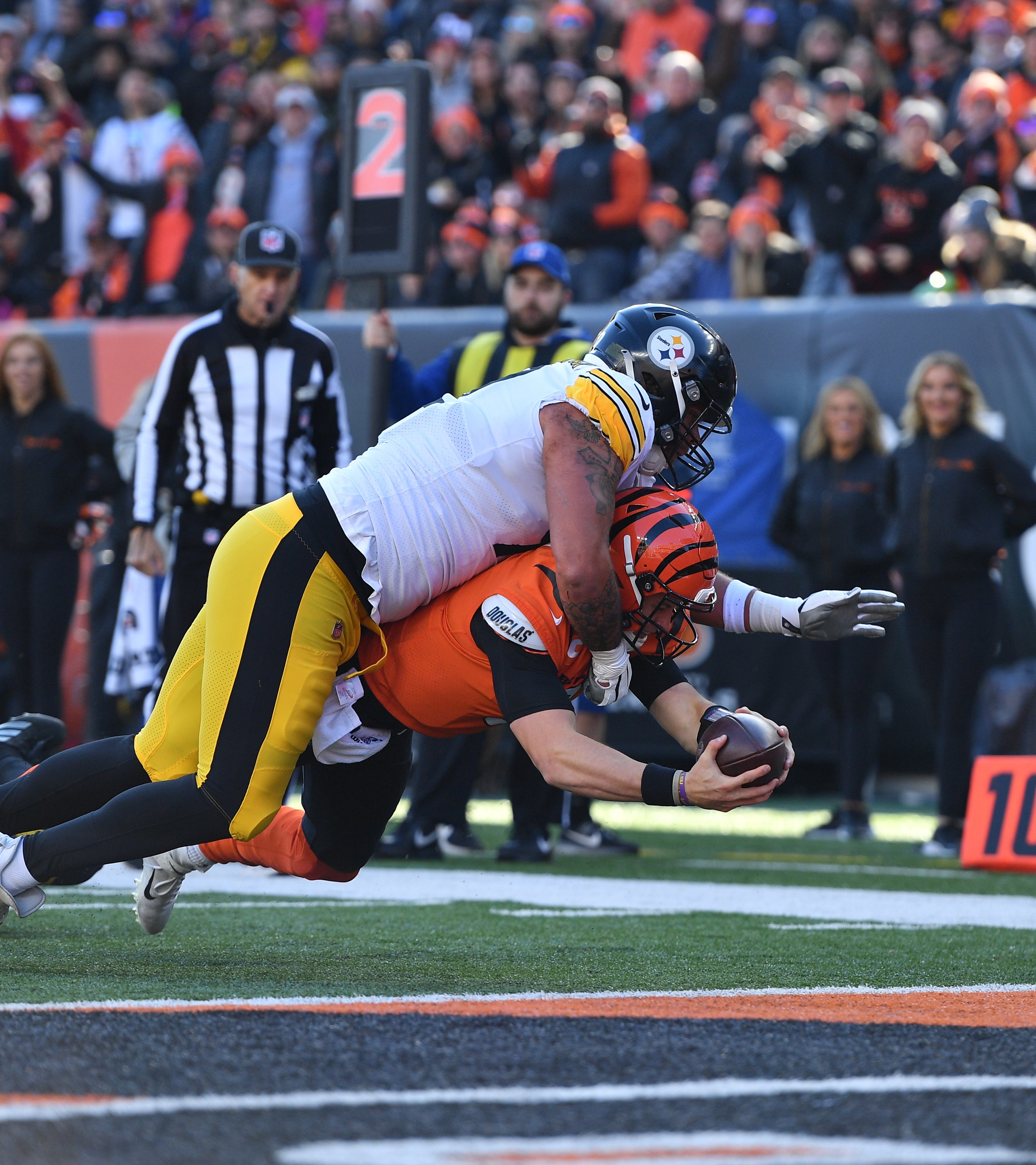 Joe Burrow diving into the end zone for a touchdown. 