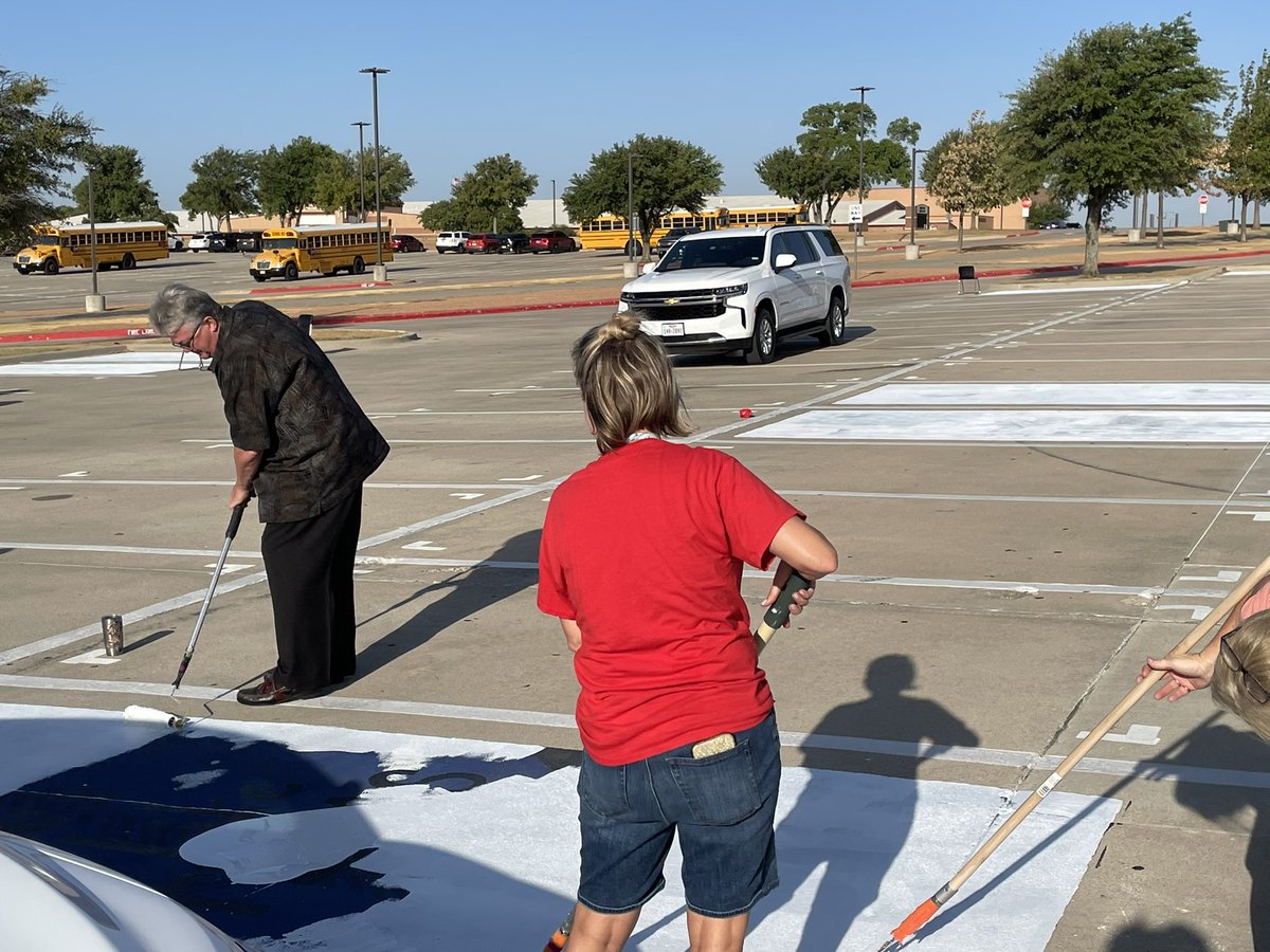 jackson_carrie's tweet photo. When you’re out early to paint over parking spots, and your @NorthwestISD Superintendent rolls up and says, “Hand me a roller; I want to help!” 🤠
#Flagship shirt for Dr. Hicks!!
@NHSTexans @NHSSeniors2023 #ServantLeader #MeaningMaker https://t.co/Aep7JGOJ9b