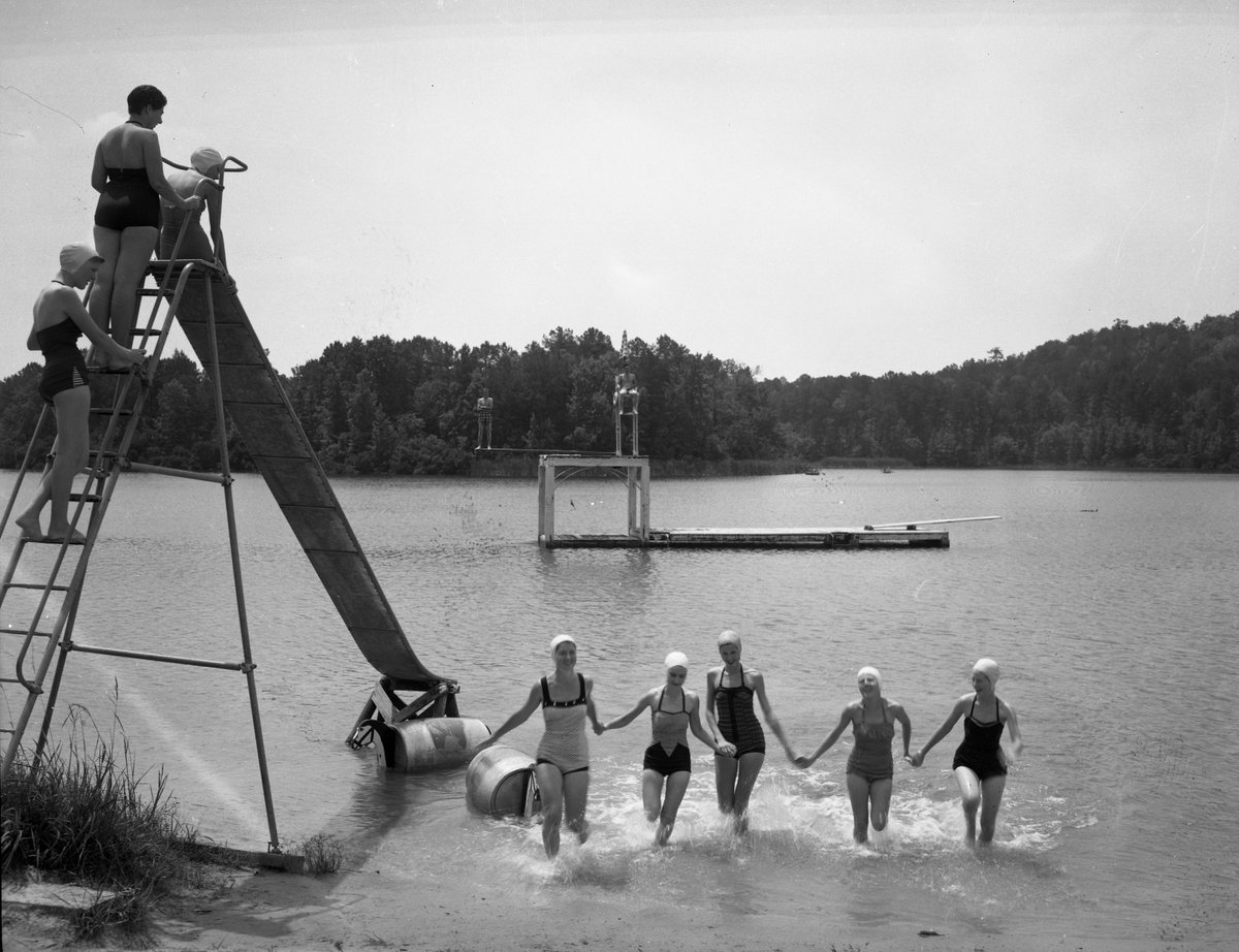 TXParksCCC's tweet photo. Notice how everyone is wearing a swimming cap?!   Those old metal slides were always an adventure in a park, but to slide on one into the water, I bet that was an experience to remember!   #BetterOutside #texasstateparks #daingerfieldstatepark #txcccparks https://t.co/4MRV0ilK7w