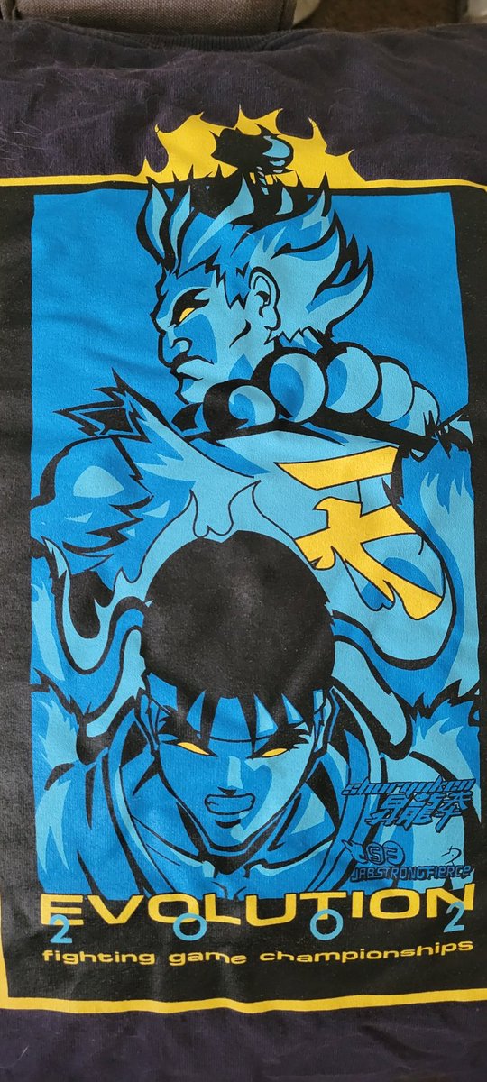 STtheGhost_'s tweet photo. About to leave for #EVO2022 found this gem while packing. My original #EVO2002 shirt, back when u got one with reg. Happy 20 year anniversary @evo happy to be returning for my 15th EVO. #OGfgc #DarkAges #FGCsince99 https://t.co/GIq1qGg6fC
