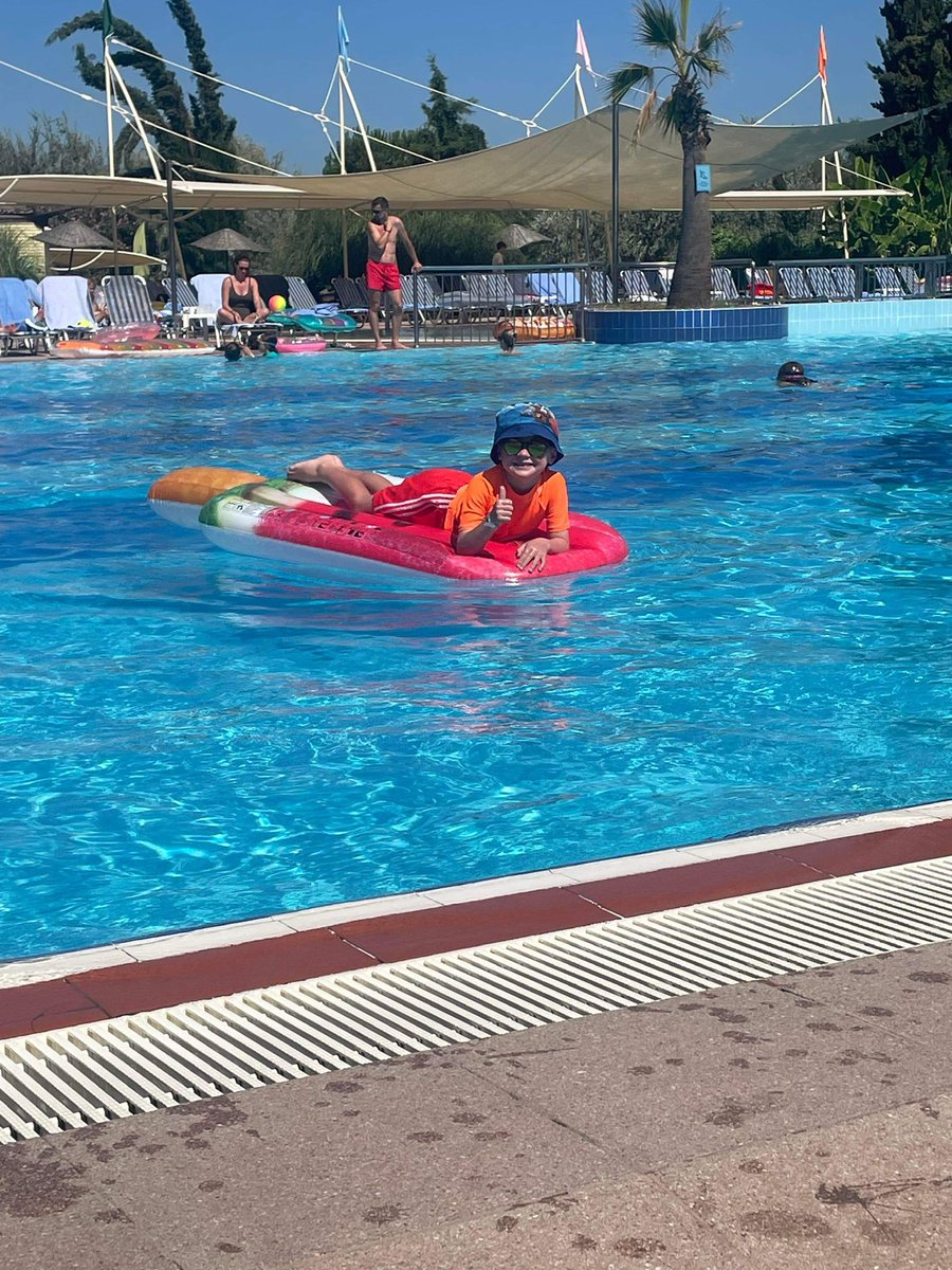 pstjfc's tweet photo. WHO WE ARE - More “PST on tour” action!

Here is PST U7s Charlie D relaxing in the pool on holiday in Turkey and getting ready to cheer on the Lionesses on Sunday Evening!

#PSTonTour #WhatAClub #PST 💛⚽️💙 https://t.co/f2ZQCMPnIR