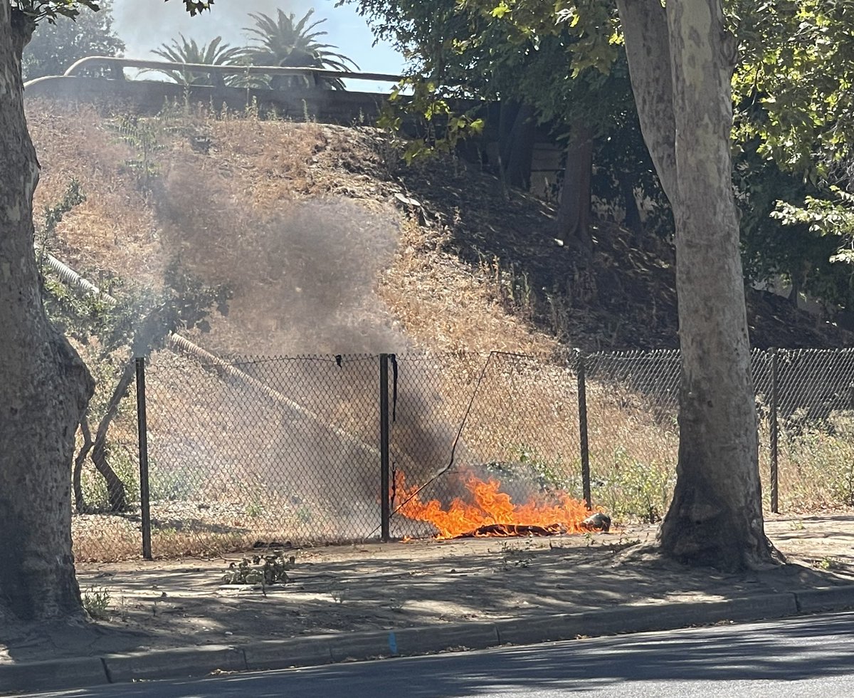SacWalkSafe's tweet photo. #dancinginthestreets this morning at G and 29th. Partially clothed local camper. Later, fire on #CalTrans property of #CapCityFreeway E and 29th. Not sure if dancer was also starting a fire, but just a little flavor of life in the neighborhood @TheCityofSac #highfiredanger https://t.co/0rDfpFZTmy