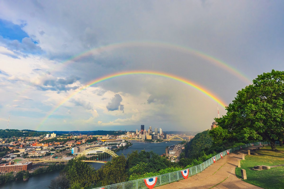What a scene in #Pittsburgh tonight. The sun came out from behind the clouds just as rain moved into the city, creating a full on double rainbow over downtown. Absolutely incredible to watch transpire and even more fun to capture. The heavy rain made it amazingly bright as well.