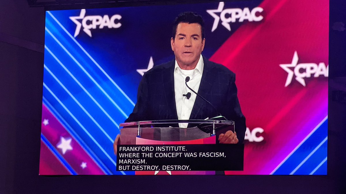 Papa John is telling the crowd there are "five entities" that control processed food and pharmaceuticals, suggesting the former make you sick so you take the latter. He says they also control media and academia. Then brings up the Frankfurt Institute. This is subtle antisemitism.