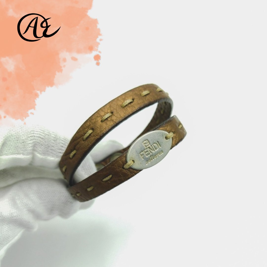 auth_experts's tweet photo. The Authentic Fendi Tan Oval ID Selleria Double Wrap Leather Bracelet is a vintage piece that you won’t see around often. 

It is made in Italy- crafted in buttery soft leather in a tan shade with shiny silver plated hardware and sold in Japan at https://t.co/aqROJi0N8F https://t.co/N4eIJn0yNz