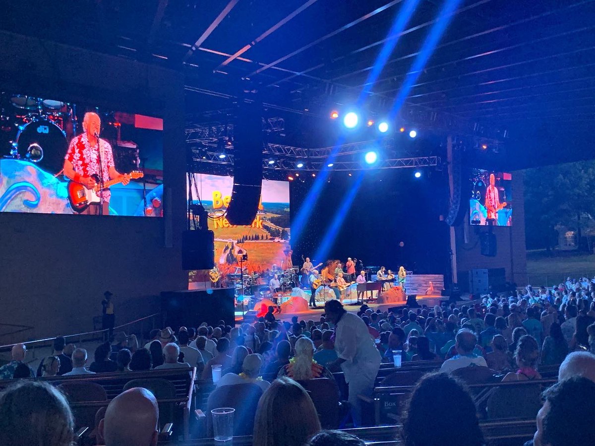 DrJKMitchell's tweet photo. So I finally attended my first Jimmy Buffett and the Coral Reefers Concert and it was held at the same spot as Woodstock in Bethel, New York. It was incredible! #ParrotheadForLife https://t.co/8dzrj4WIbV