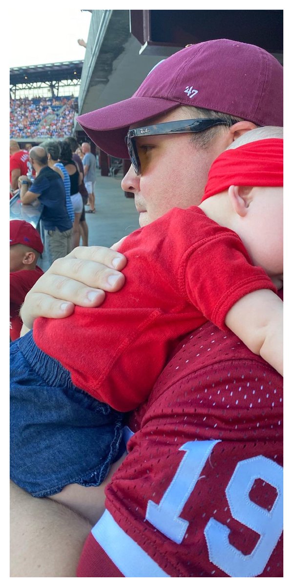 BillMoen's tweet photo. My wife and I took our daughter to her 1st @Phillies game. She was an Opening Day baby, after all.

She watched @Noahsyndergaard make his 1st start— and get the win! She saw the @rhyshoskins HR in 1st inning, too. 

Building the next generation of Phillies Nation…

#RingTheBell https://t.co/1HCN4mwAYv