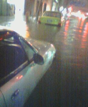 JetblackND's tweet photo. 水害で車がダメになるツイートを見ると思い出す。2004年の台風の中、明治通りで信号待ちしてただけで水没。廃車。写真はだいぶ水が引いてるけどミラーのすぐ下まで浸かってた。動かなくなった車の運転手が道路脇のラーメン屋に集まったな。 https://t.co/elbVI4BX3H