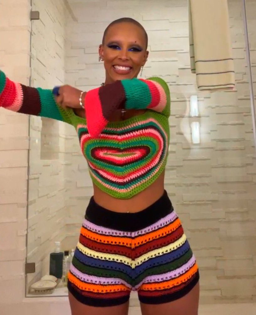 Doja cat in this long sleeve sweetheart top. The description says this  piece is designed by Molly Tooher-Rudd.