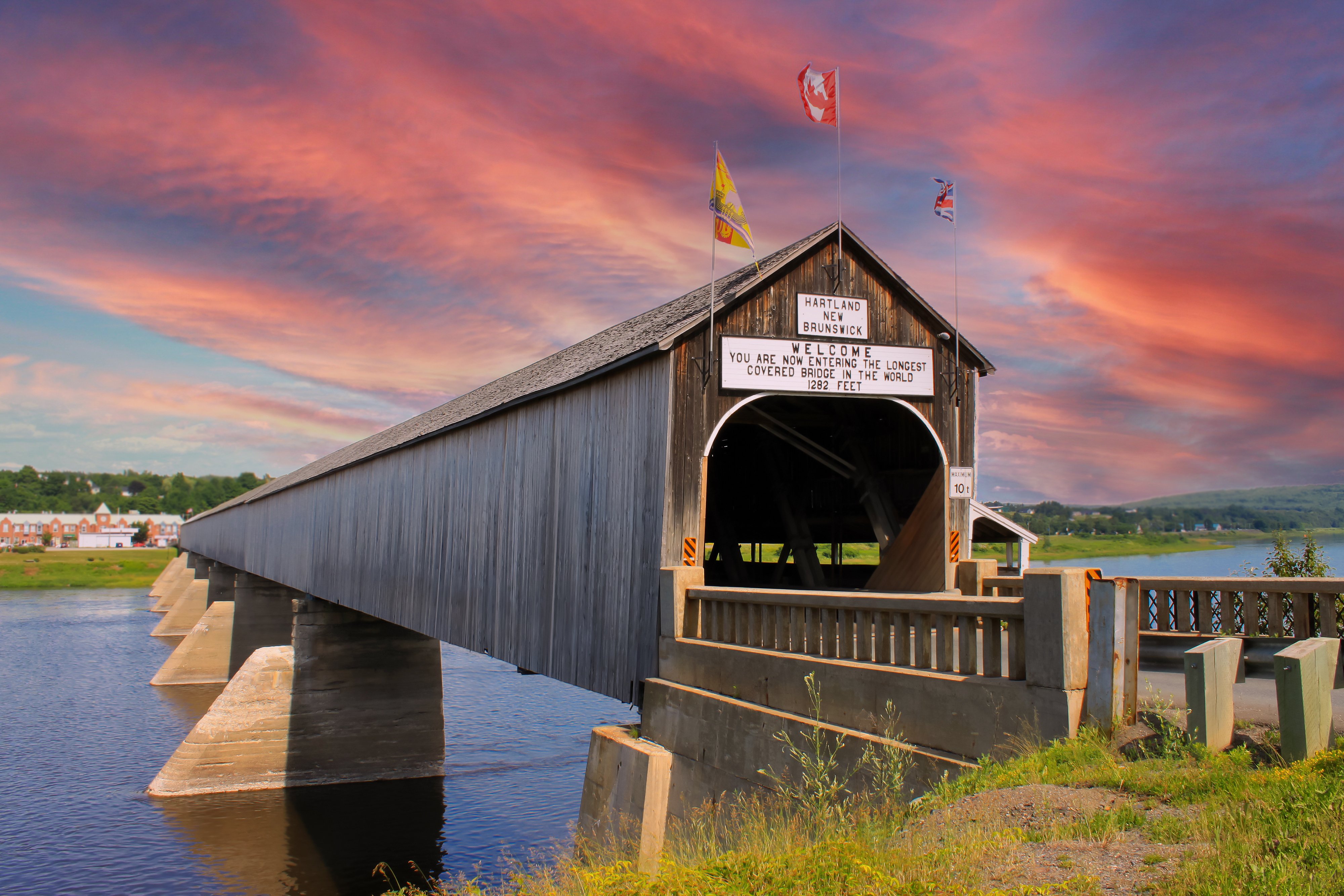 Canada on X: "If you're searching for the longest covered bridge in the  world, look no further! The Hartland Covered Bridge, spanning 390.75 metres  over the Saint John River in #NewBrunswick, is