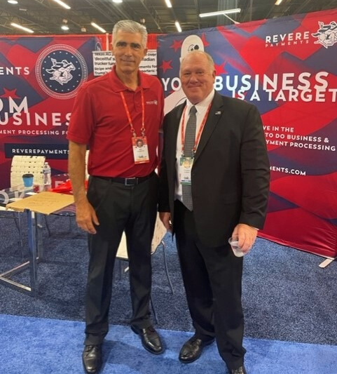 ReverePayments's tweet photo. It is such an honor to be @CPAC2022 TX! Seen here is Dee Oldroyd posing in front of our booth with Tom Homan, the former Director, U.S Immigration and Customs Enforcement. #CPAC2022 #cpactx https://t.co/t5afQMA9jD