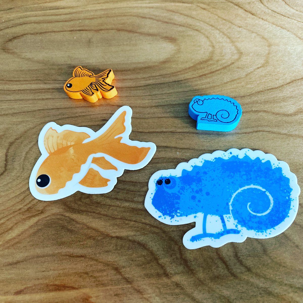 lastnightgames's tweet photo. I guess we love little custom wooden pieces in our games…and maybe animals 🤔
We also love having classy vinyl stickers for each game 😉
#thefinestfish #lifeofachameleon #boardgames #boardgamecomponents #boardgameaddicts https://t.co/dxxRouONhm