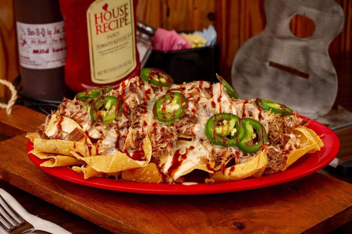 Tupelo2Go's tweet photo. Nacho day? Get BBQ by Jim delivered for a happy Friday! #tupelo2go #supportlocal #yourelaxwedeliver https://t.co/sOxC1S9dmV