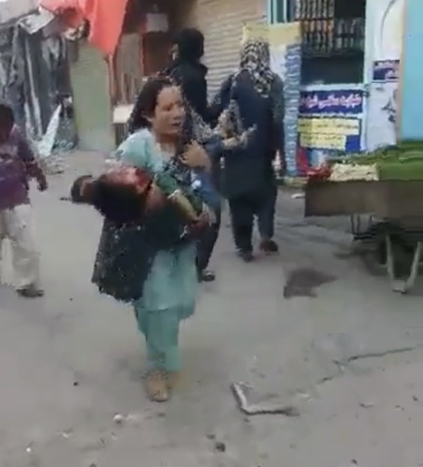 rezarvhimi's tweet photo. A Hazara mother holds her son's dead body in her arms. "Oh god, where to go?" she screams. The image is a screenshot from a video circulating on social media related to today's blast in western Kabul, a Hazara-dominated area. #StopHazaraGenocide https://t.co/hHfeyBY6tb