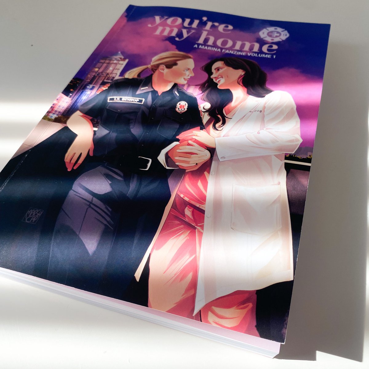 Hey, look what just came in the mail!

This is the hard proof of the Marina Fanzine! We got it from the printer to make sure everything looked good before they start printing… and we approved it! (which means the physicals are officially on the way!)

(Continue reading below)