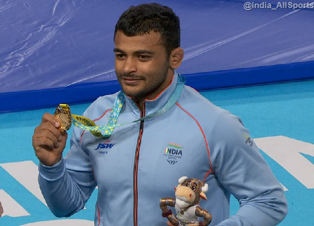India_AllSports's tweet photo. Picture Time 
Deepak Punia on the victory podium after winning GOLD medal ❤️ 
#CWG22 
#CWG2022India https://t.co/OwoaBWe1N7