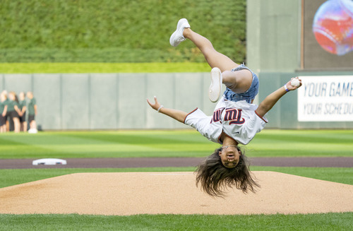 StarTribune's tweet image. Olympic gold medalist Suni Lee did a flip as she threw out the honorary opening pitch Friday night at Target Field before the game between the #mntwins and Toronto Blue Jays. Photo by @KormannAlex