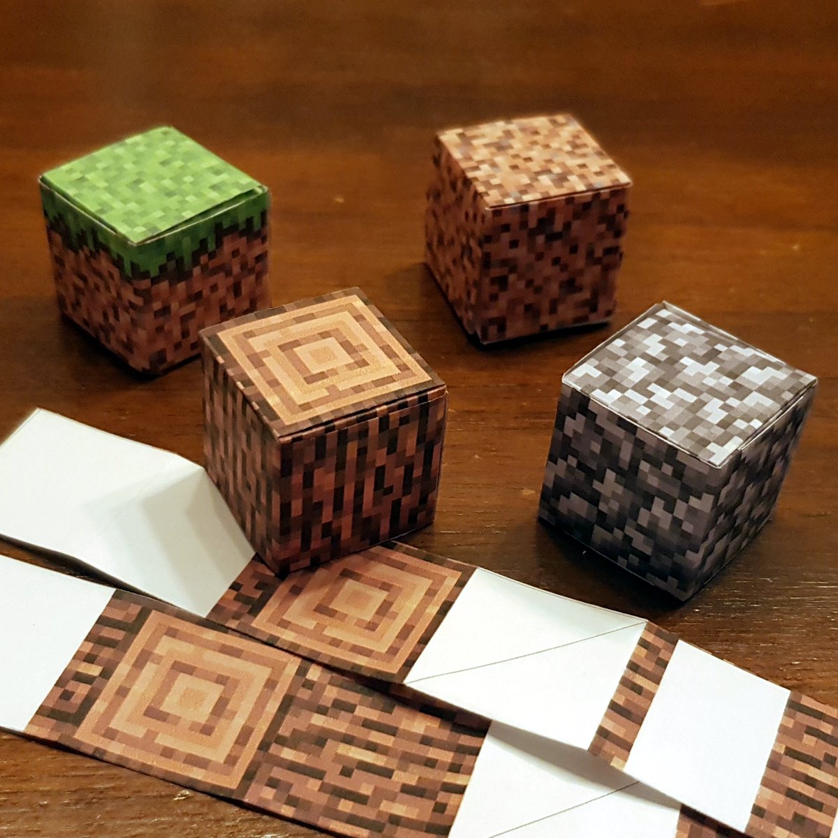 What's the difference between papercraft and origami? According to me, it's the use of glue, tape or scissors. If it's only folded squares and rectangles, it's origami. The origami Minecraft blocks are modular origami. #折り紙 #ペーパークラフト #マインクラフト