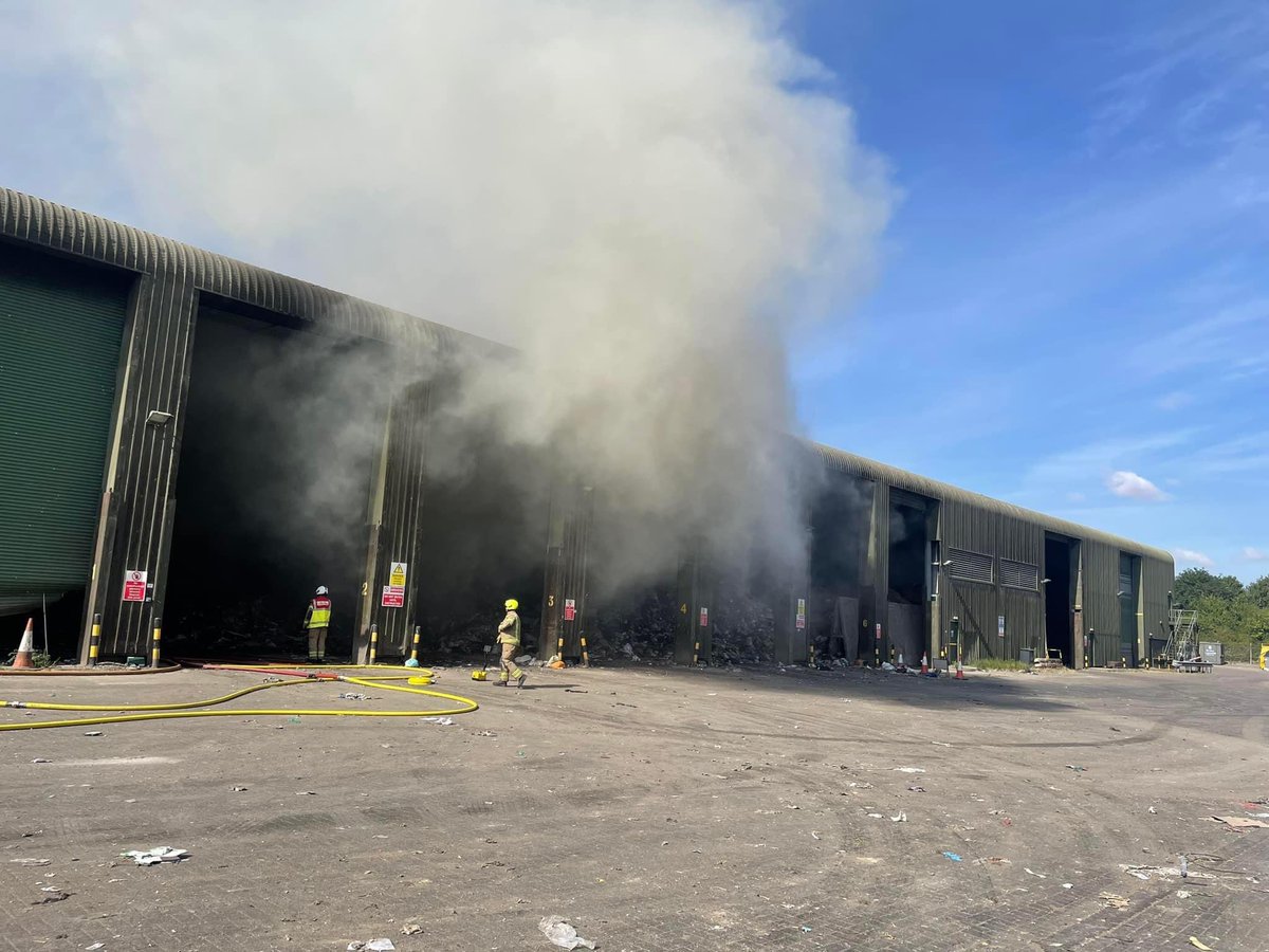 BedsFire's tweet photo. Bedfordshire Fire and Rescue Service currently have several appliances in attendance at a large fire at a waste management site in Elstow, Bedford. We would like to advise residents in the area to keep doors and windows shut. Please avoid the area. https://t.co/GuJj69oDej