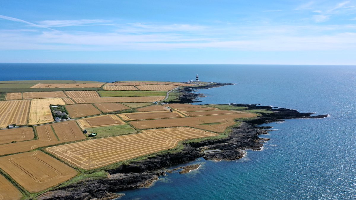 CarlowWeather's tweet photo. Dry weather means farmers are busy harvesting at present so take care on roads in rural areas. I just took these photos near Hook Lighthouse in Wexford. A fine spot looking even better on a great day. https://t.co/DU0lfDhaKT