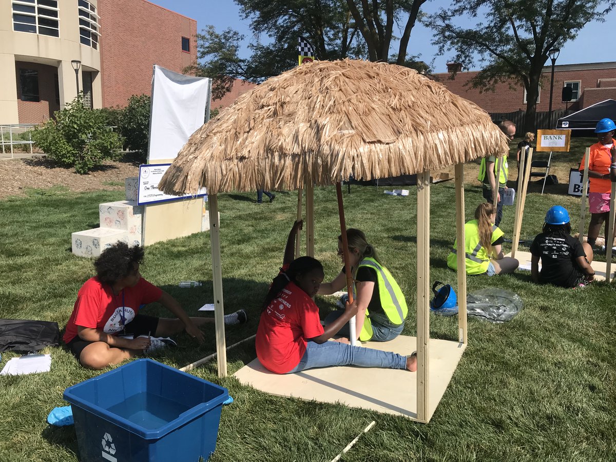 AquaAfrica's tweet photo. Build a Hut summer camp competitor's partnered with Omaha business coaches. Here, @GirlsIncOmaha's team receive guidance from Abby Incontro, an architect at Holland Basham architecture. #BuildaHut @UNOmaha https://t.co/ZqibcnT73b