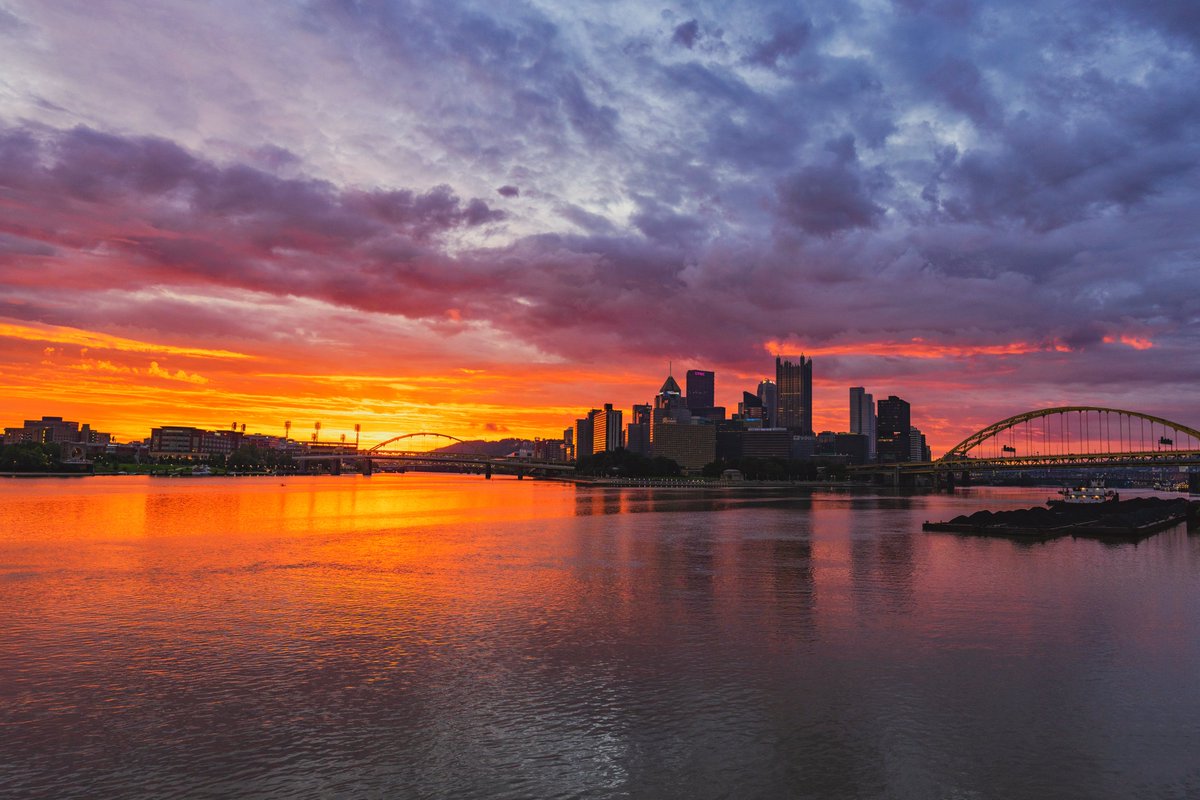 DaveDiCello's tweet photo. It may be raining in #Pittsburgh now, but just before sunrise today the sky was pretty incredible. There was just enough of an opening on the horizon to let the sunlight through, which lit up the low clouds with vibrant pink and orange tones. Red sky at morning, and all that. https://t.co/hqfK6r9VUd