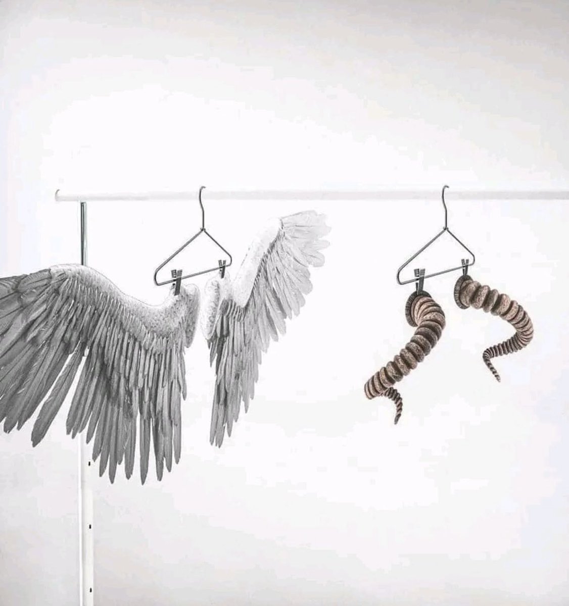 the light is dying and the night is coming, now, perhaps, you can choose whether to be an angel or a demon. 
 #StreetArt #Art #Beauty #Angel #Demon #blackandwhite  #BeYourself