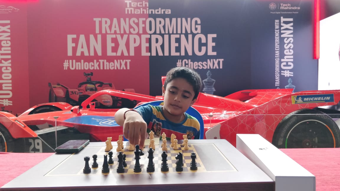 ara_ram's tweet photo. @anandmahindra  thanks 👍 sir for the initiative at International chess Olympiad #ChessOlympiad2022. My son tried out at the kiosk!! First time he experienced #AI based Magnetic board!!! https://t.co/2o3idanS55