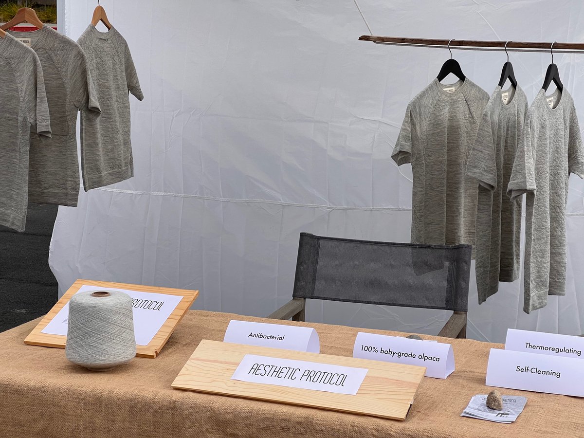 brian_a_burns's tweet photo. Martine is selling her Aesthetic Protocol shirts for the first time at the Santa Rosa farmers market!

The shirts are made of seamless, 3D-knit, baby alpaca fiber and have crazy antimicrobial properties. https://t.co/bATgt9i6i1