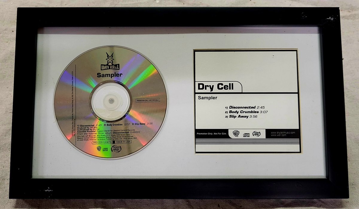 card_boarded's tweet photo. CD's are an important part of my Dry Cell collection. I am hoping to someday get a physical copy of every one they've ever been a part of. One of my favorites so far is this 3-track sampler. Love how it looks framed like this too. #DryCell #NuMetal https://t.co/ksvIBZx6ZL