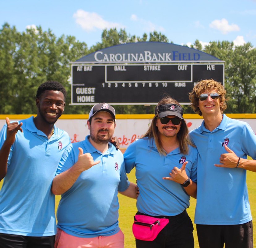 UofSC_HRSM's tweet photo. Lots of garnet and black mixed in with the @FloFlamingos pink this summer! (L-R) intern Xavier Peguese, alumnus Brennan Webster (B.S. Sport and Entertainment Management, '21, Director of Ticket Operations/Inside Sales),interns Gabriel Cobb and Jake Floyd. #GoFlamingos 🦩 #UofSC https://t.co/u1MGRu1c5T