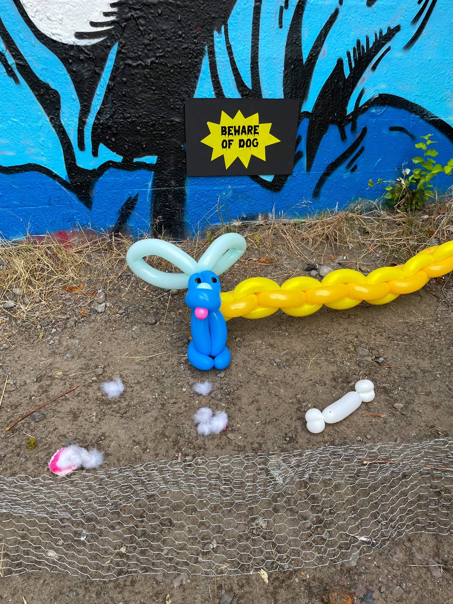 proseandpucks's tweet photo. item 46: Your balloon animal guard dog next to a menacing "beware of dog" sign. The more menacing the environment the better. #gish #item46 https://t.co/0HnNemY3zT
