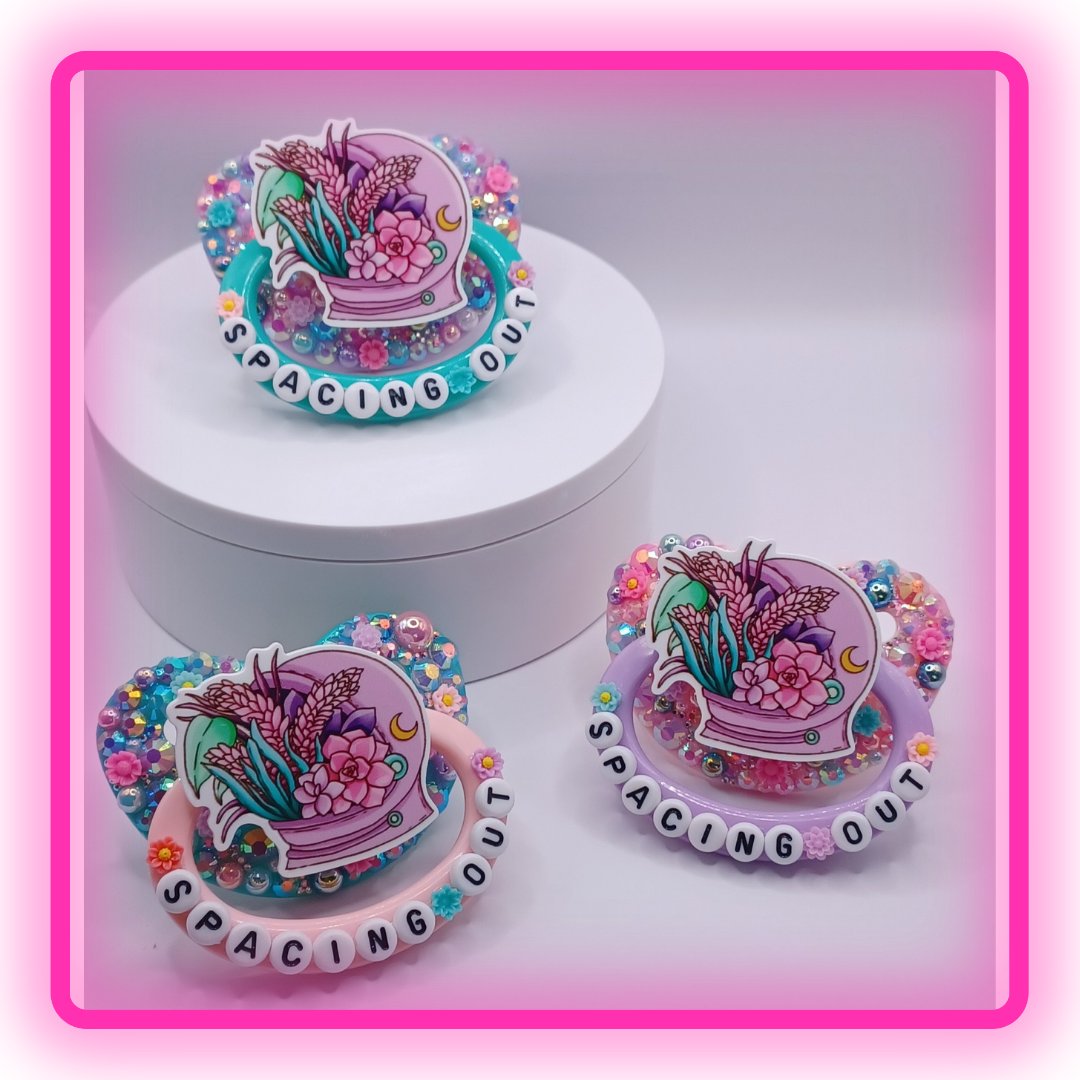 LittleShop89's tweet photo. This beautiful Pacifier has a pink, purple, green, and teal rhinestone and pearl mix with the wording spacing out on the handle. #adultpacifer #adultpacifiershop #decopaci #adultpaci #adultpacifierstore #smallbiz #decoadultpacifier #littlespace #kidre #noncom #decopacifier https://t.co/fIc9I14hx5