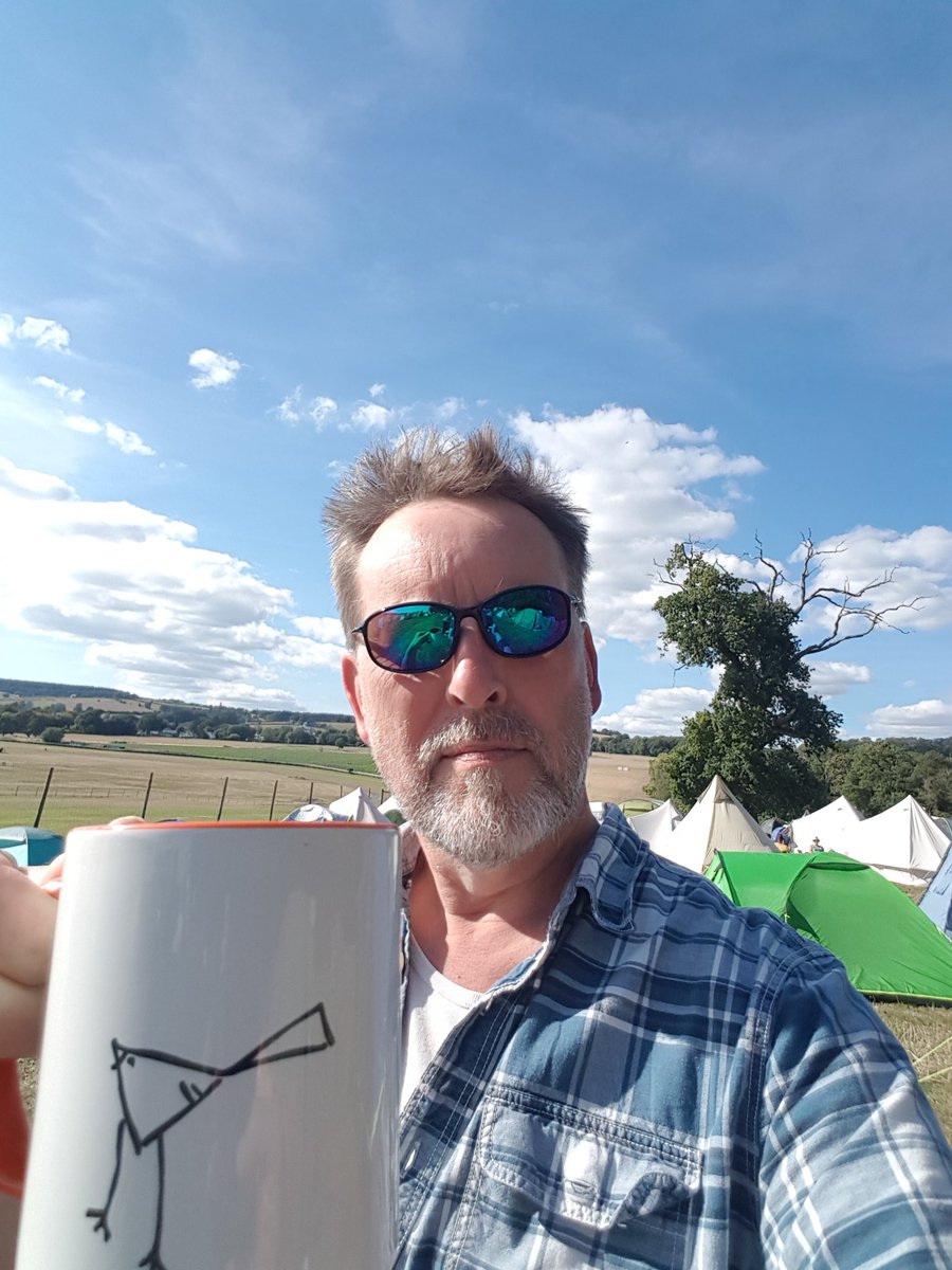 Chilling at Green Gathering 22 with a cuppa in my shiny new orange mug after a fantastic <a href="/uklittlesparrow/">Little Sparrow</a> set at the Triban stage. Lovely to see them again after so many years.
Ukejam work is done for another year. Looking forward to #GG23
#GreenGathering
#LittleSparrow
#Ukejam