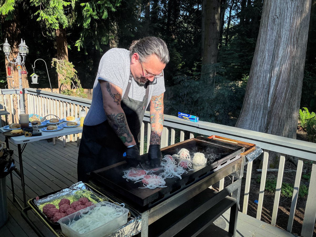 Joel smashing burgers.