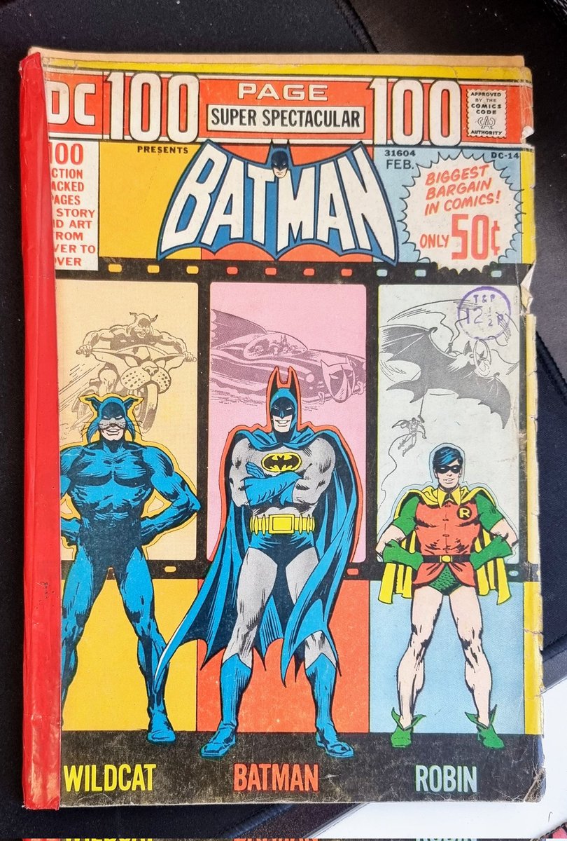 wowcomixretail's tweet photo. Today's lunch break read is a 100 page #Batman Super Spectacular from 1973 featuring some slightly less spectacular spine repair work and a cover from Nick Cardy!
#lunchtimecomic #onthedesk #comic #Batman #dccomics #Robin #Wildcat #lunchbreak #OTD https://t.co/nzeWfa6XqG