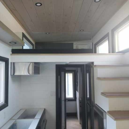 DoorsandMore's tweet photo. Tiny homes call for tiny railing! A transportable tiny home required small railing with base shoe to enclose the loft area. We used base shoe in Matte Black to mount it. Simply stunning! #glassrailing #tinyhome #matteblack #baseshoe #customglass https://t.co/TKoP3rLjnC